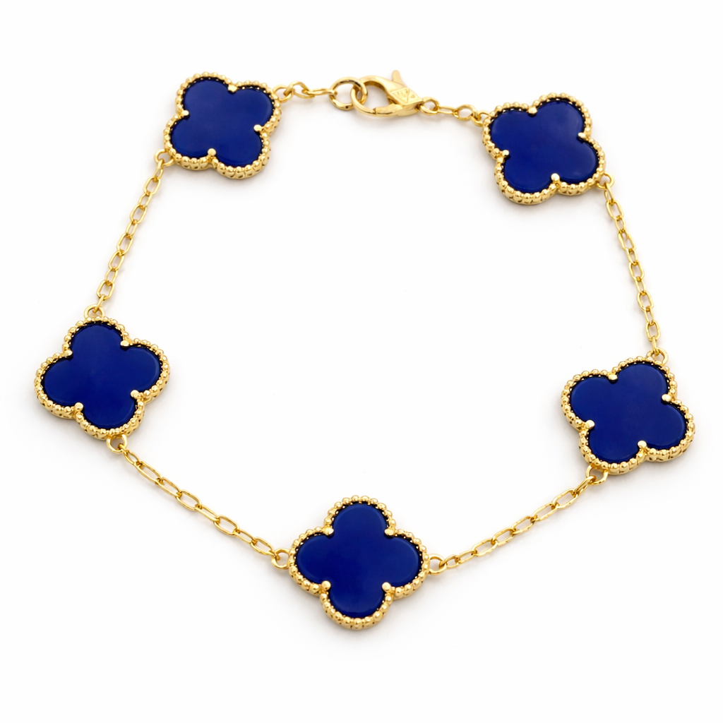 Gold bracelet with blue clover-shaped charms on a white background